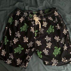 Men’s navy blue swim trunks with green, blue and White Sea turtle print